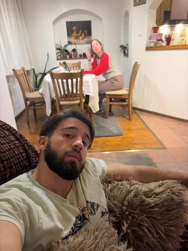 Two people relax indoors in Sofia evening setting