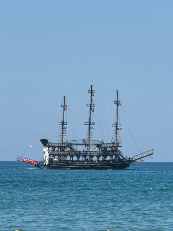 Pirate ships, parasailing, and yachts off Manavgat coast