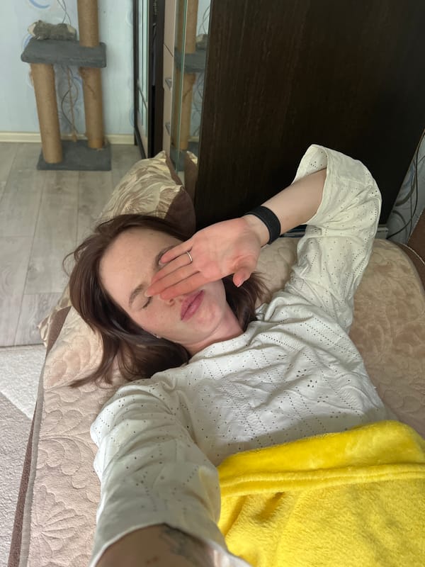 Woman resting on bed observed in Chaikovsky, Russia