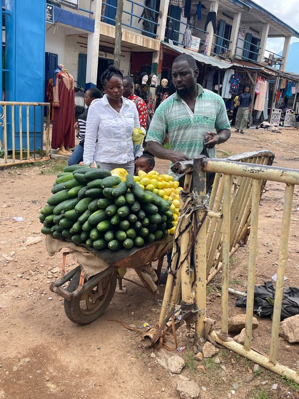 Fresh produce vendors at a Jos street market