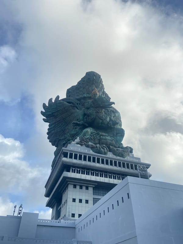 Tourist captures low-angle view of Garuda Wisnu Kencana statue
