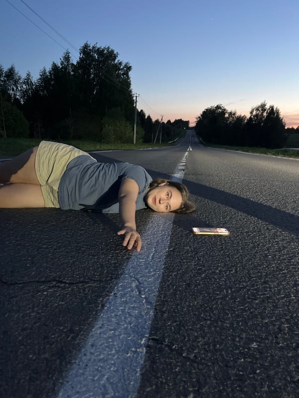 Women gather on road in Ольховка, Russia at dusk