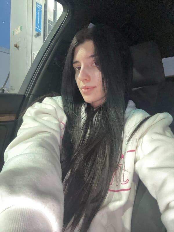 Woman rests in car at Sofia gas station