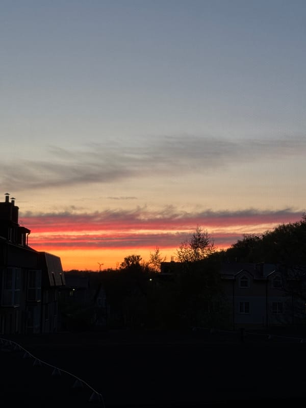 Sunset observed over residential Kaliningrad with vibrant orange skies