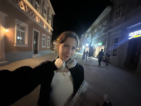 Woman documents nighttime walk through downtown Novi Sad with selfies