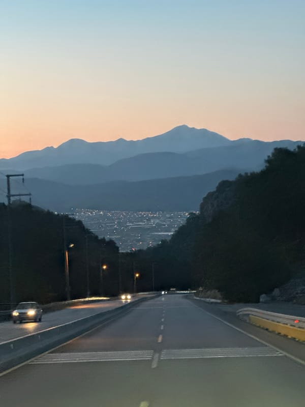 Evening traffic flows through Fethiye as dusk settles