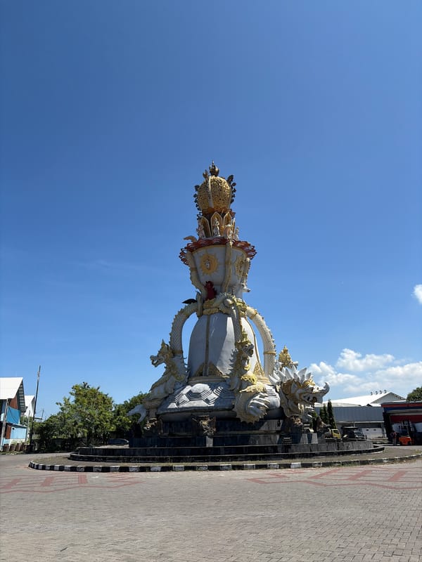 Morning documentation of ornate statues and marina in Denpasar