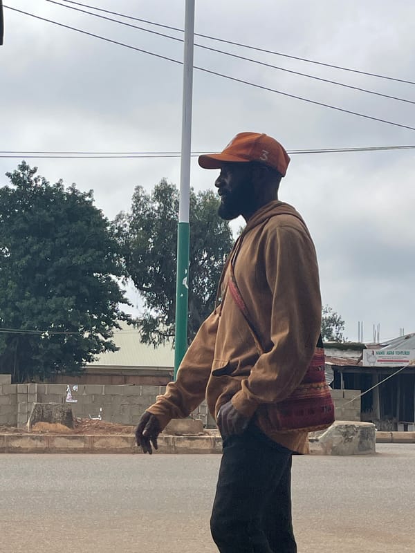 Everyday street life along a busy Bukuru road