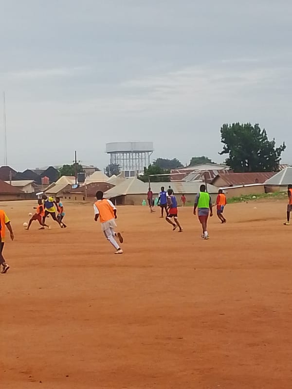 Soccer training session held on dirt field in Bukuru