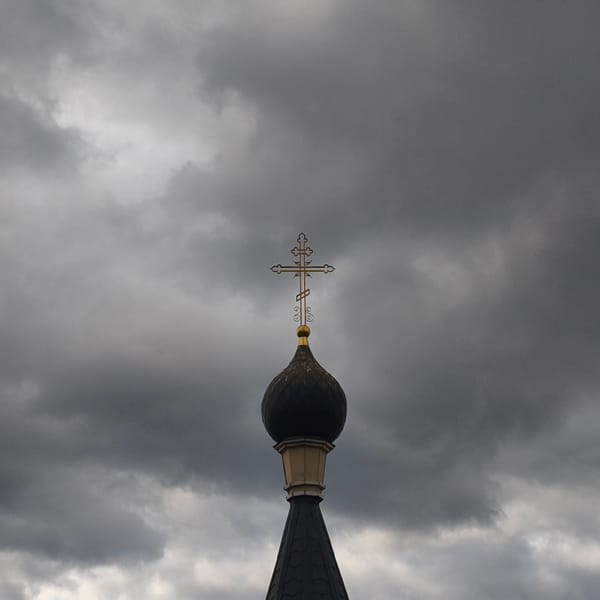 Overcast morning captures religious dome, spinning wind turbine in Hrodna