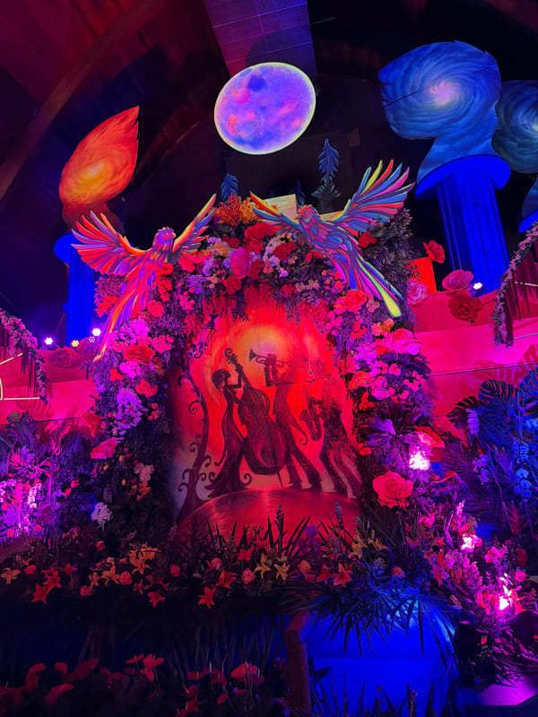 Colorful art installation with rainbow bird sculptures documented in Pomona