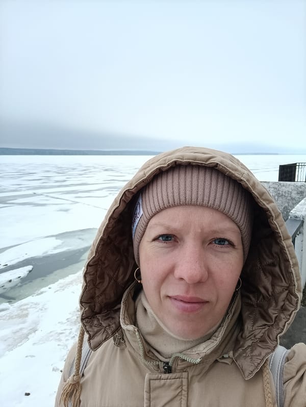 Woman takes selfie near frozen water in Chaikovsky, Russia
