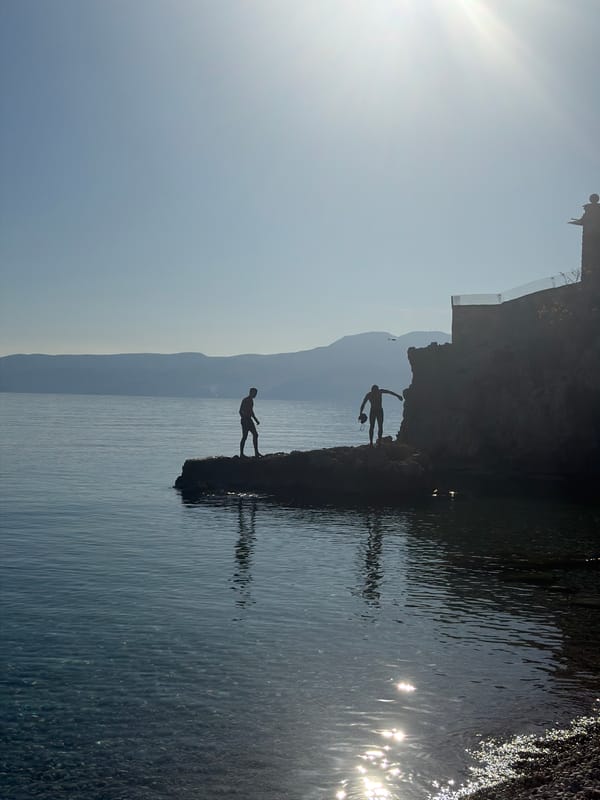 Spring afternoon beach activities captured at Rijeka's Adriatic coastline