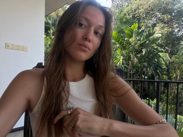 Everyday moments captured in Unawatuna: woman, squirrels, suspended doll