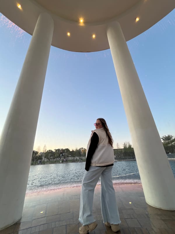 Visitors photograph at illuminated circular structure in Krasnodar