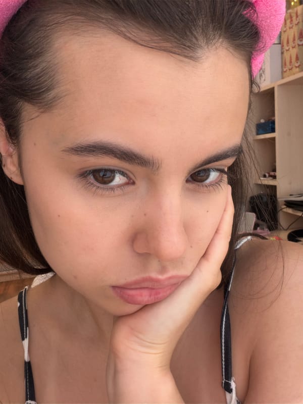Woman takes early morning selfies with flowers in Chaikovsky