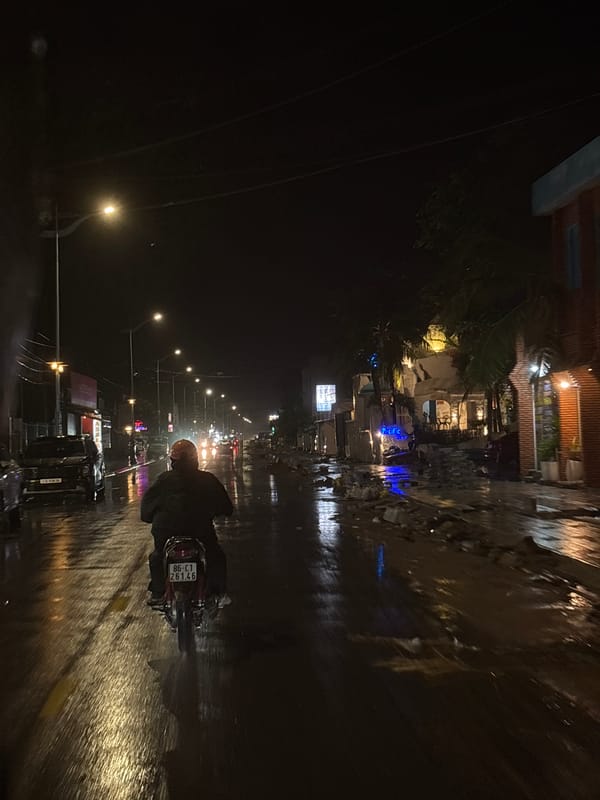 Rainy night motorcycle ride through Mũi Né streets