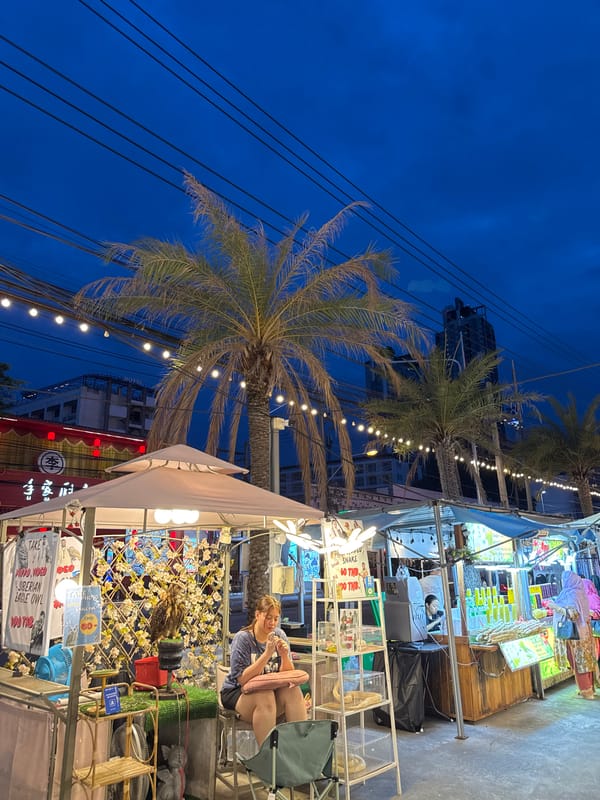 Pattaya night market with durian stalls and a 747 landmark