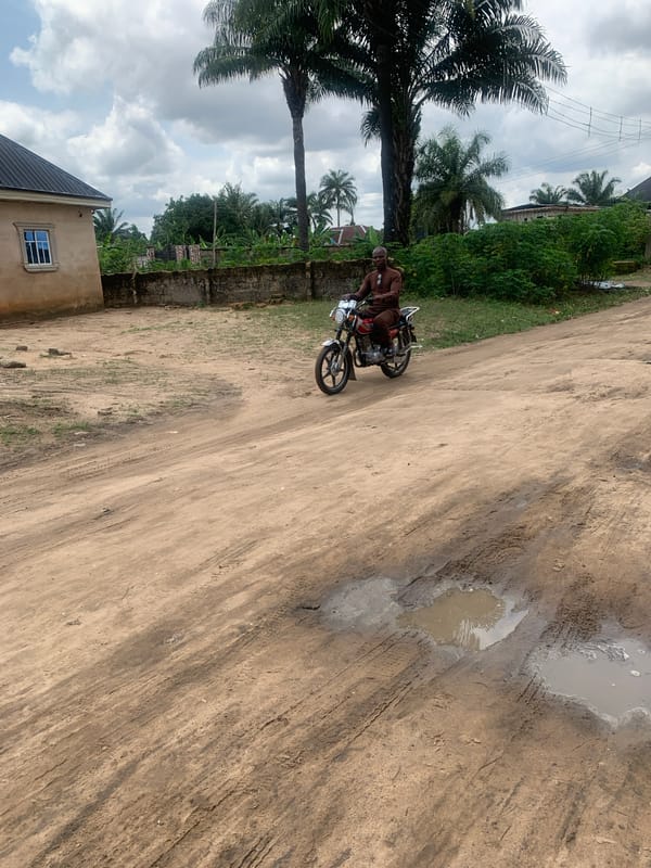 Daily life documented on dirt roads in Aba, Nigeria