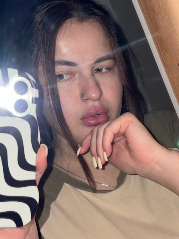 Woman takes selfie while lying down in Kaluzhskaya