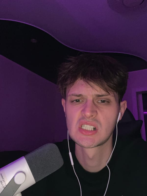 Late-night gaming session with purple LEDs, selfies, and a cat