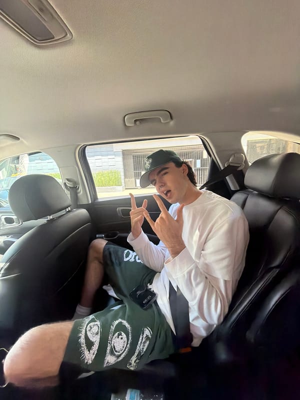 Man makes peace signs from car backseat in West Hollywood