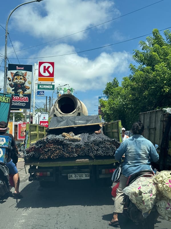 Construction truck carrying rebar observed in Kuta Selatan traffic