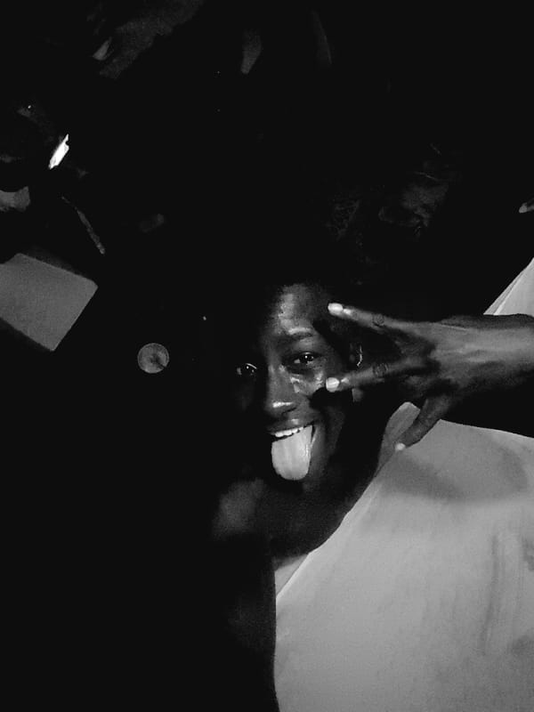 Low-light indoor hangout captured in black and white, Narayi