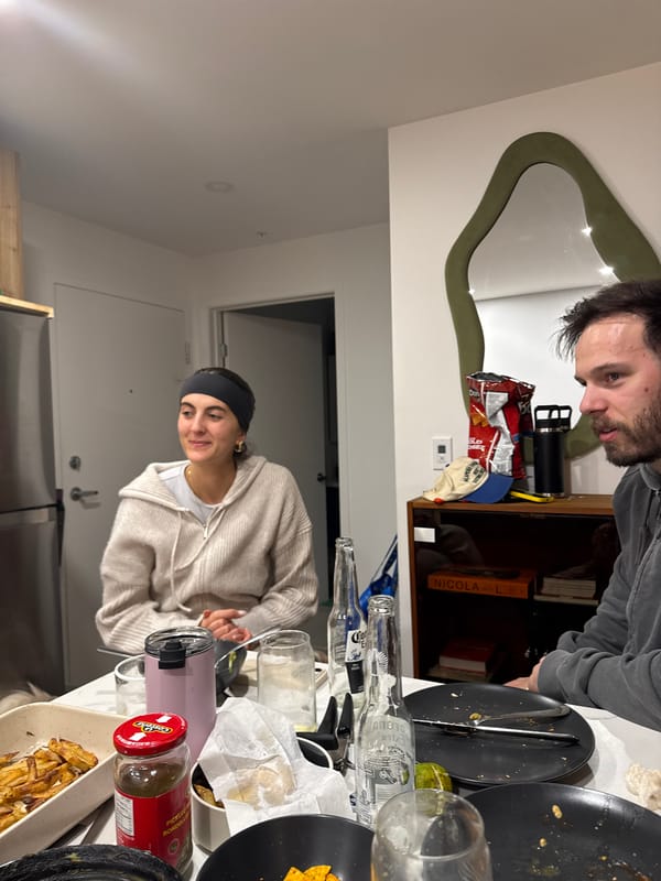 Casual indoor gathering with food and drinks in Laval