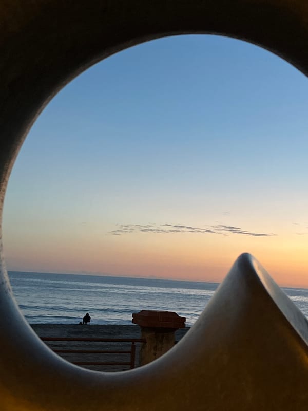 Sunset scenes documented at Alanya beach with cat, beachgoers
