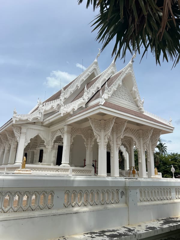 Inside a Koh Samui temple complex with mummified monk and ornate grounds