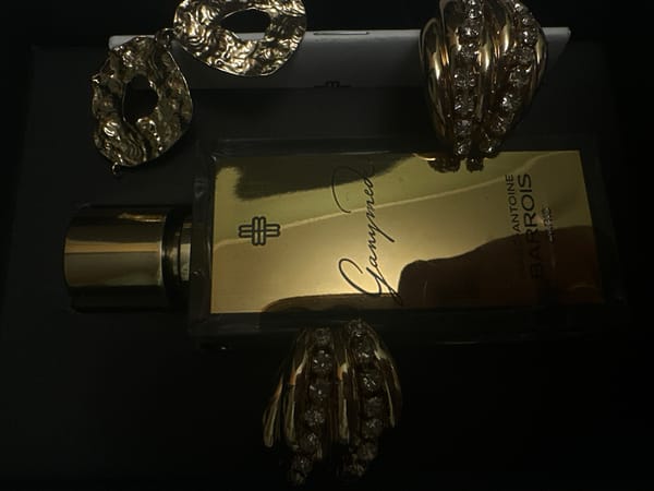 Luxury cosmetics display documented in Riga featuring designer perfume, jewelry