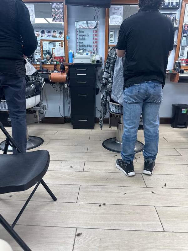 New Yorkers go about daily routines at barbershop and cafe