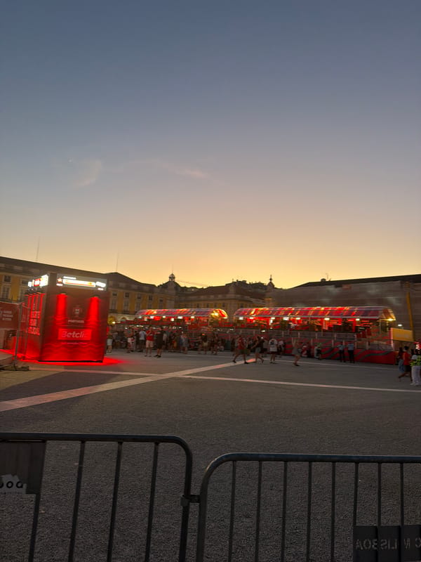 Lisbon's Praça do Comércio buzzes at dusk during football fan event