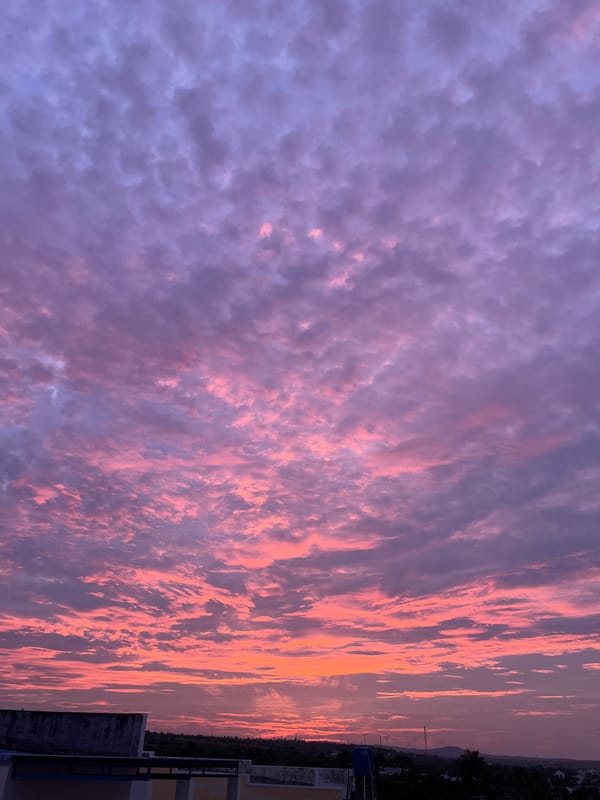 Vivid sunset sky over Mũi Né rooftops