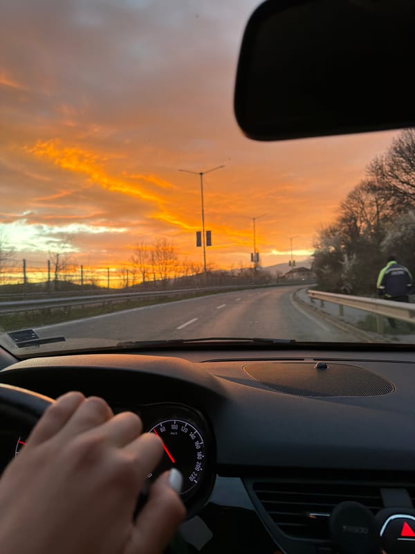 Motorist photographs sunrise scenery on Bulgarian road near Pernik