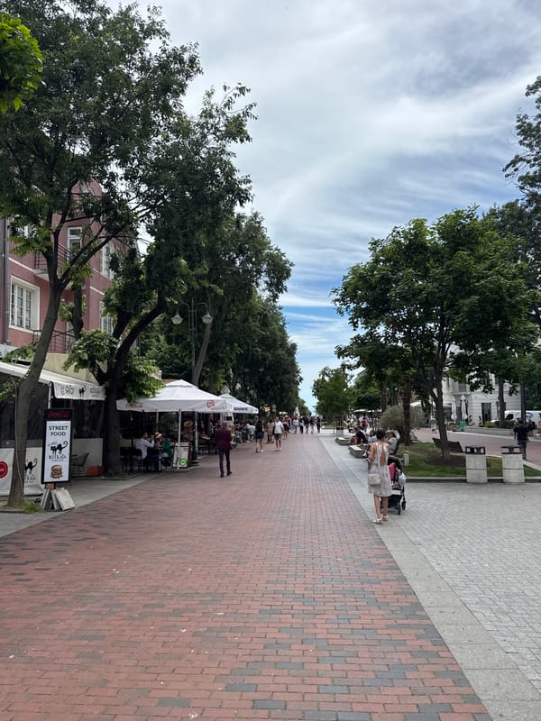 Morning café scene on Varna's pedestrian street, seagulls included