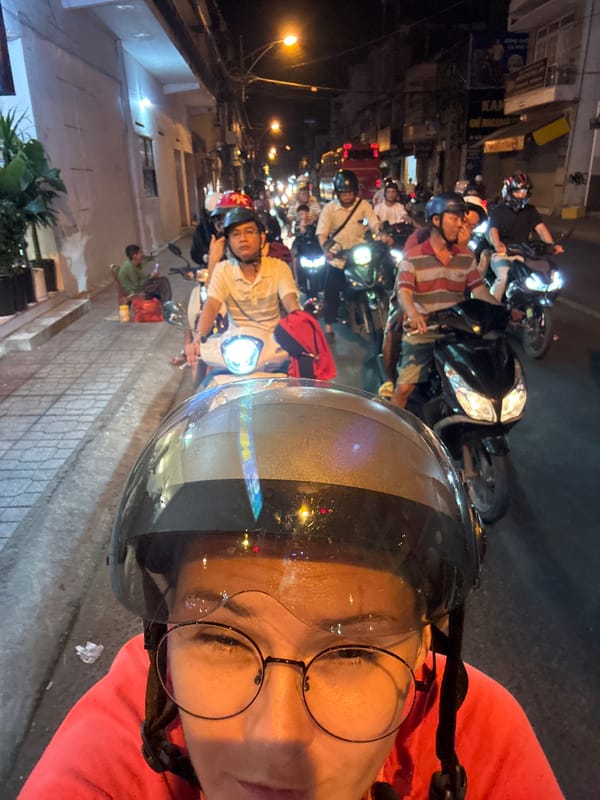 Nha Trang nighttime streets from the back of a Grab bike