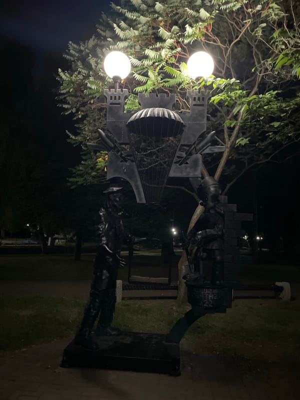 Evening stroll through a lit memorial park in Brest