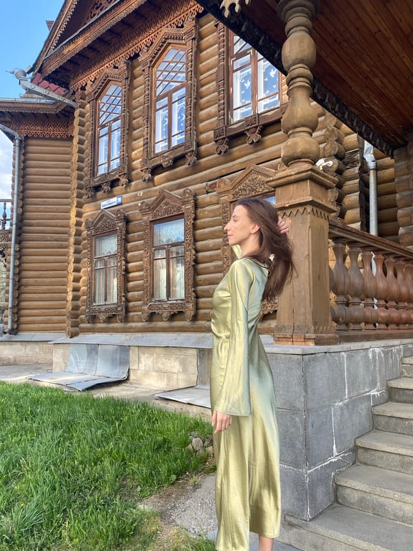 Woman poses for photos at historic Yekaterinburg landmark