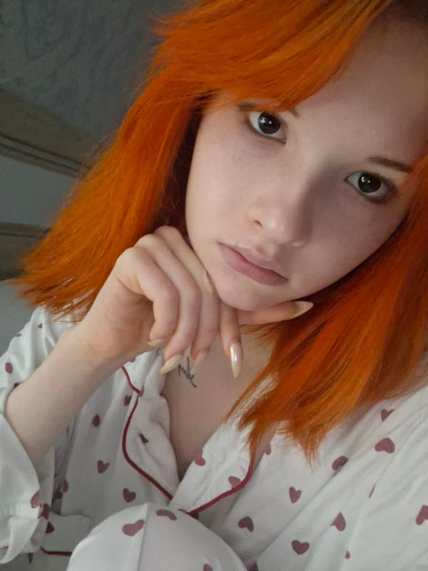 Woman takes selfies in heart-patterned pajamas in Chaikovsky, Russia