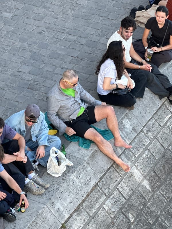 Parisians gather around fabric-wrapped Pont Neuf art installation