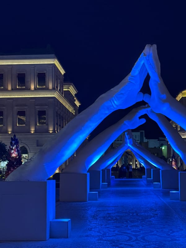 Doha's illuminated landmarks captured during evening cultural district tour