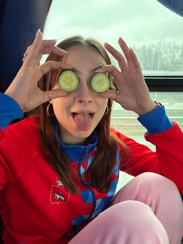 Woman poses with cucumber eye treatment in Yanychi, Russia