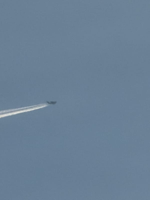 Sky watching session captures contrails and moon over Bulgarian town