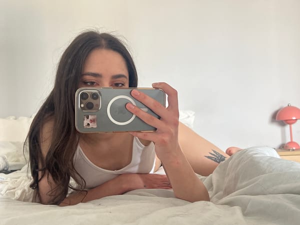 Woman takes selfies in bed in Ternopil, Ukraine