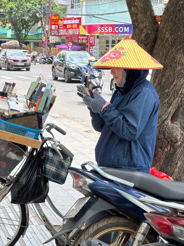 Early morning street life along a Nha Trang sidewalk