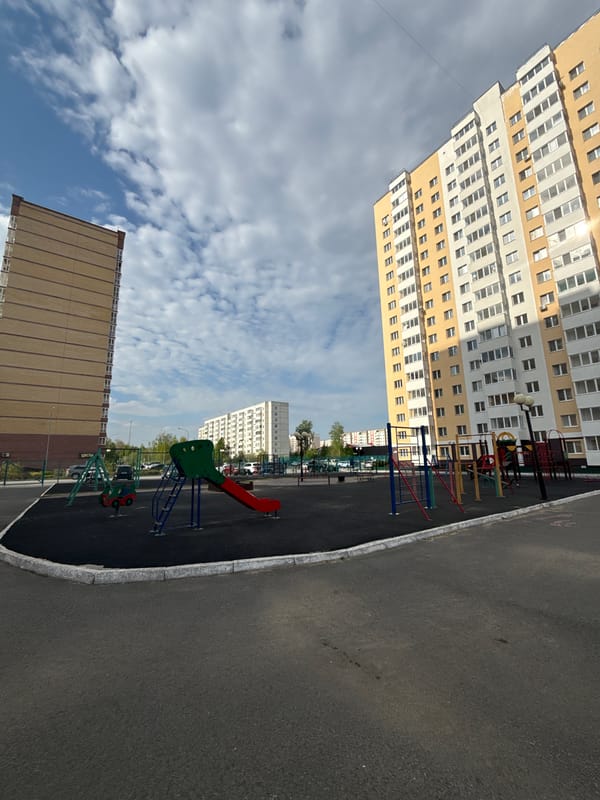 Family playground visit documented in Tobolsk residential area