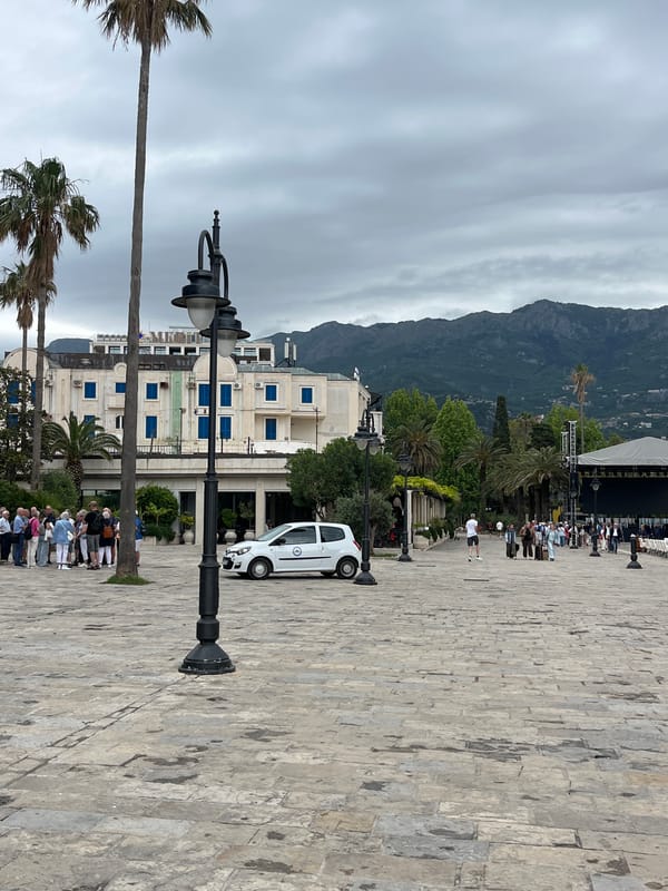Tourists explore Budva's old town on cloudy morning