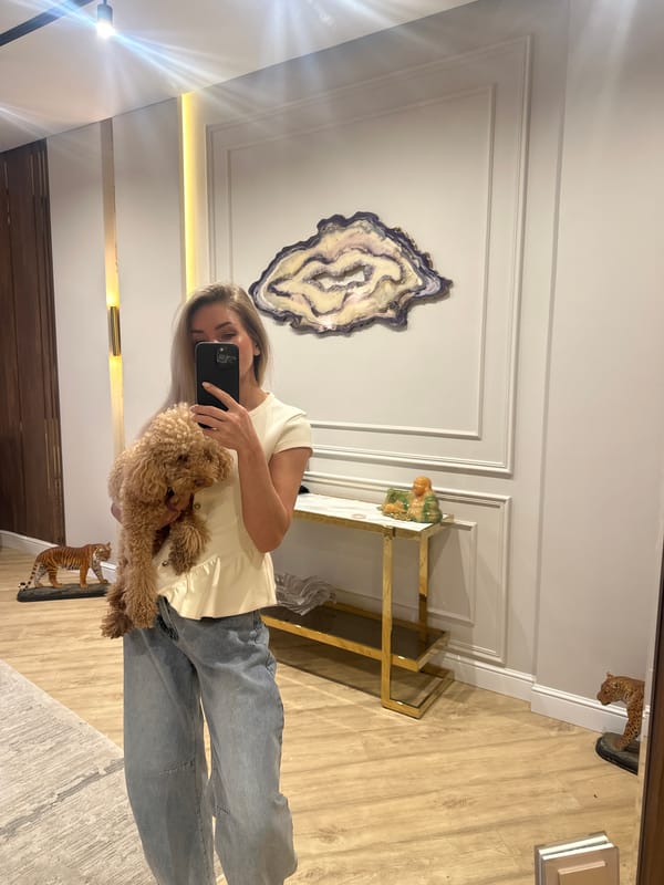 Woman takes mirror selfies with poodle in Armavir home